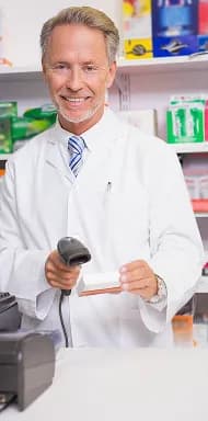 pharmacist-using-machine-holding-medicine
